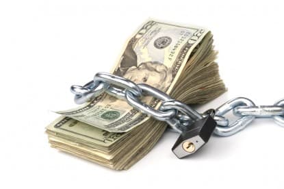 stack of 20 dollar bills wrap with chain and pad lock