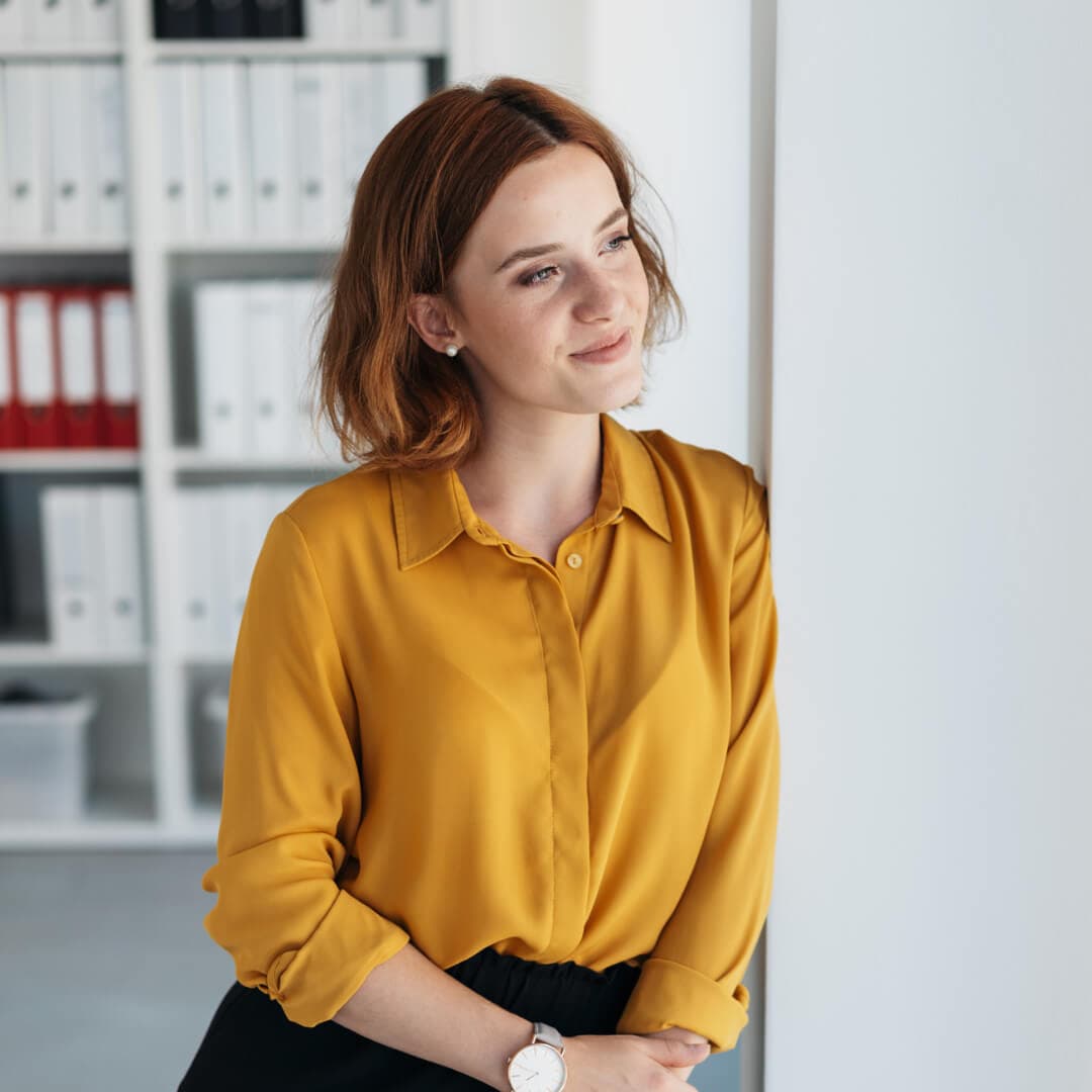 Small business owner smiling about strong strategy to combat inflation