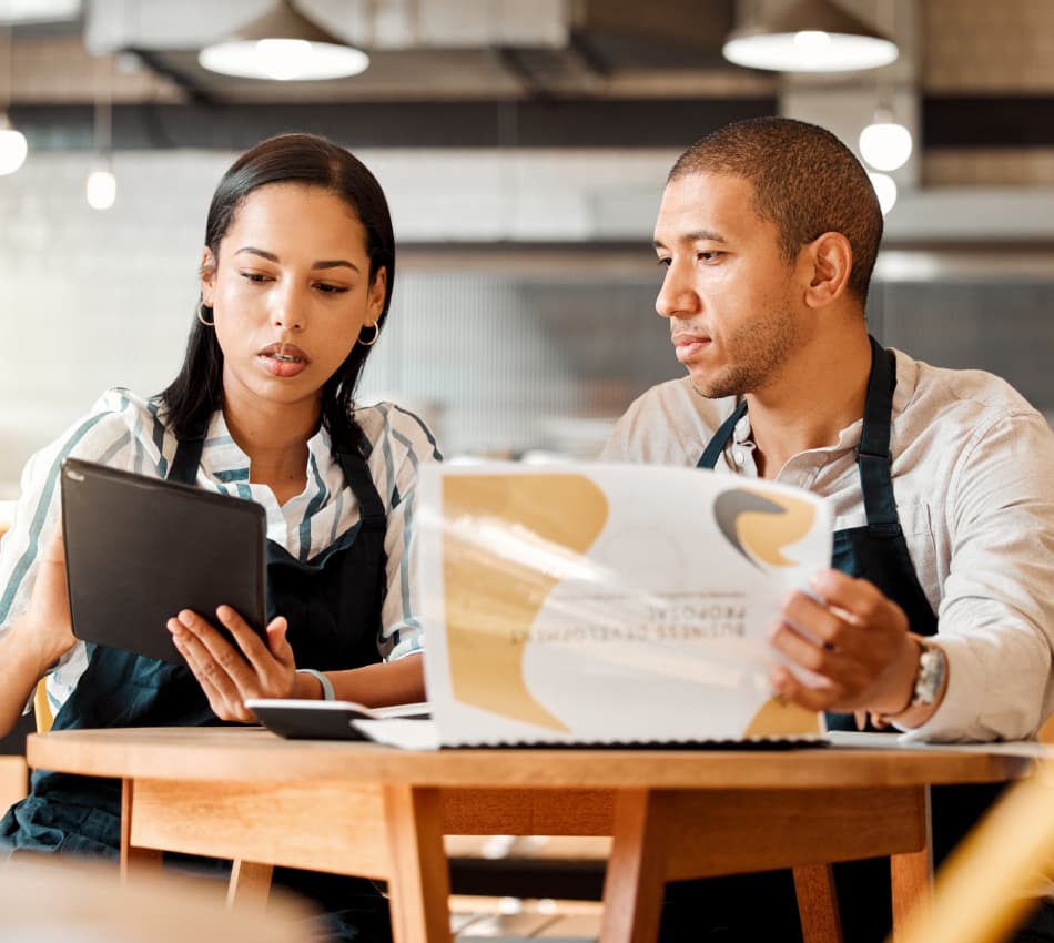 Two small business owners discuss franchising plans.