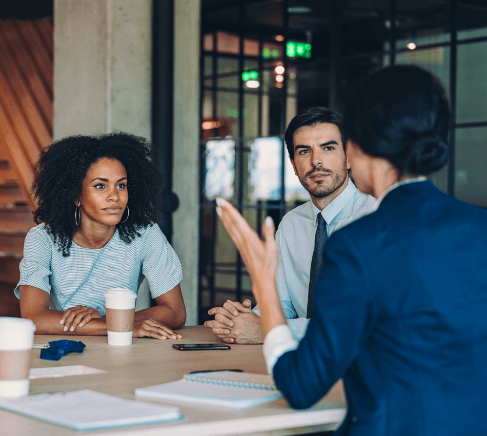 Key small business stakeholders discuss strategy in a meeting.