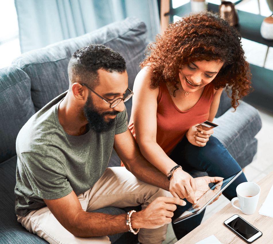Business co-owners activate their debit card using a mobile banking app.