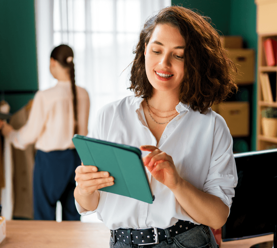 Small business owner reviewing 2025 finances on a tablet