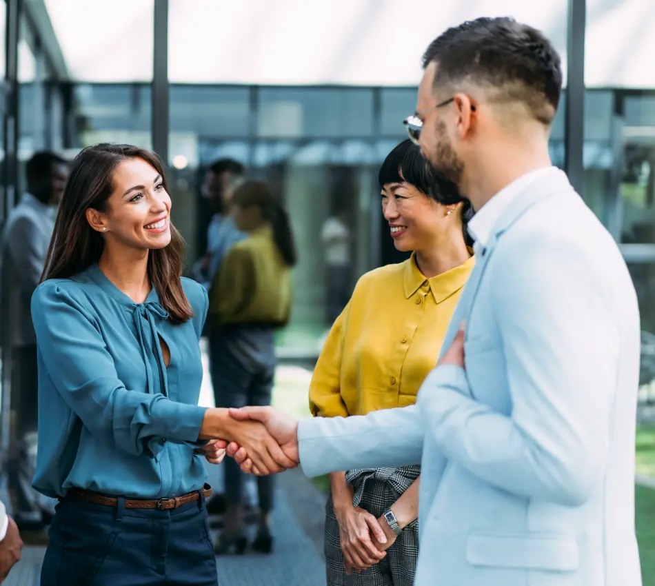 Interview panel shakes hands with a job candidate.