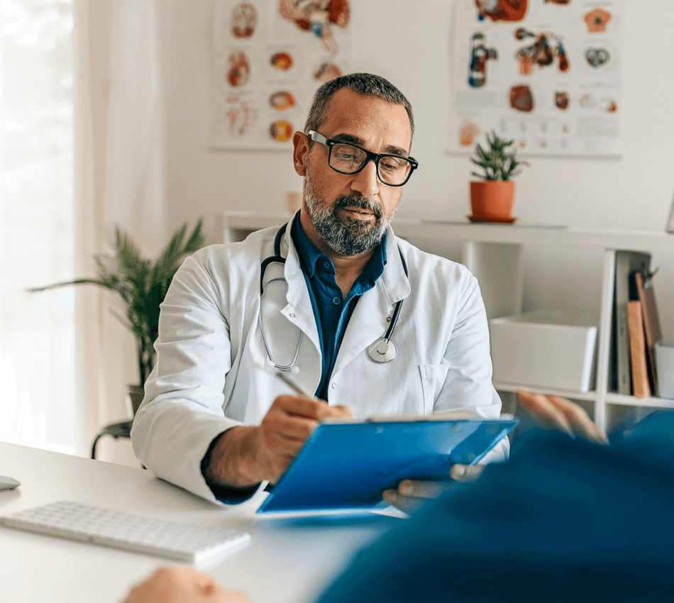 A doctor reviews a patient's chart.