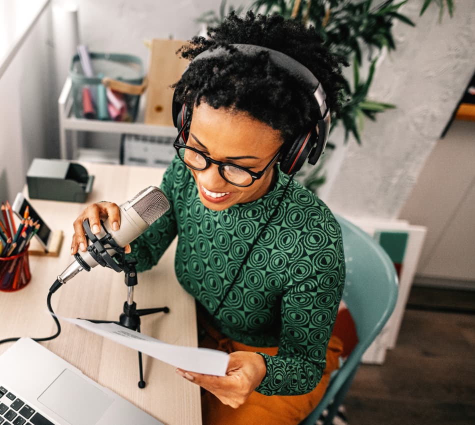 Small business owner records a podcast to promote her business engage with her audience.