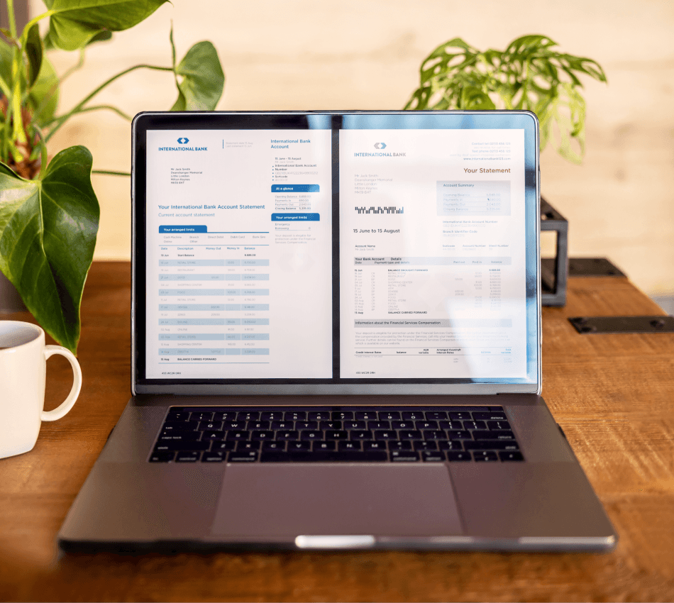 Laptop used to pay business bills online to optimize cash flow.