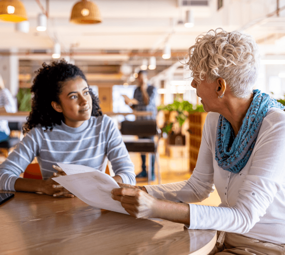 two women working together in a cafe