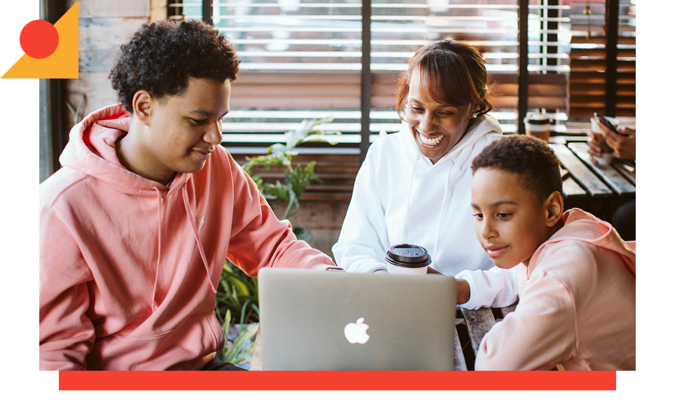 Nashira Lynton with her two sons at the computer smiling together