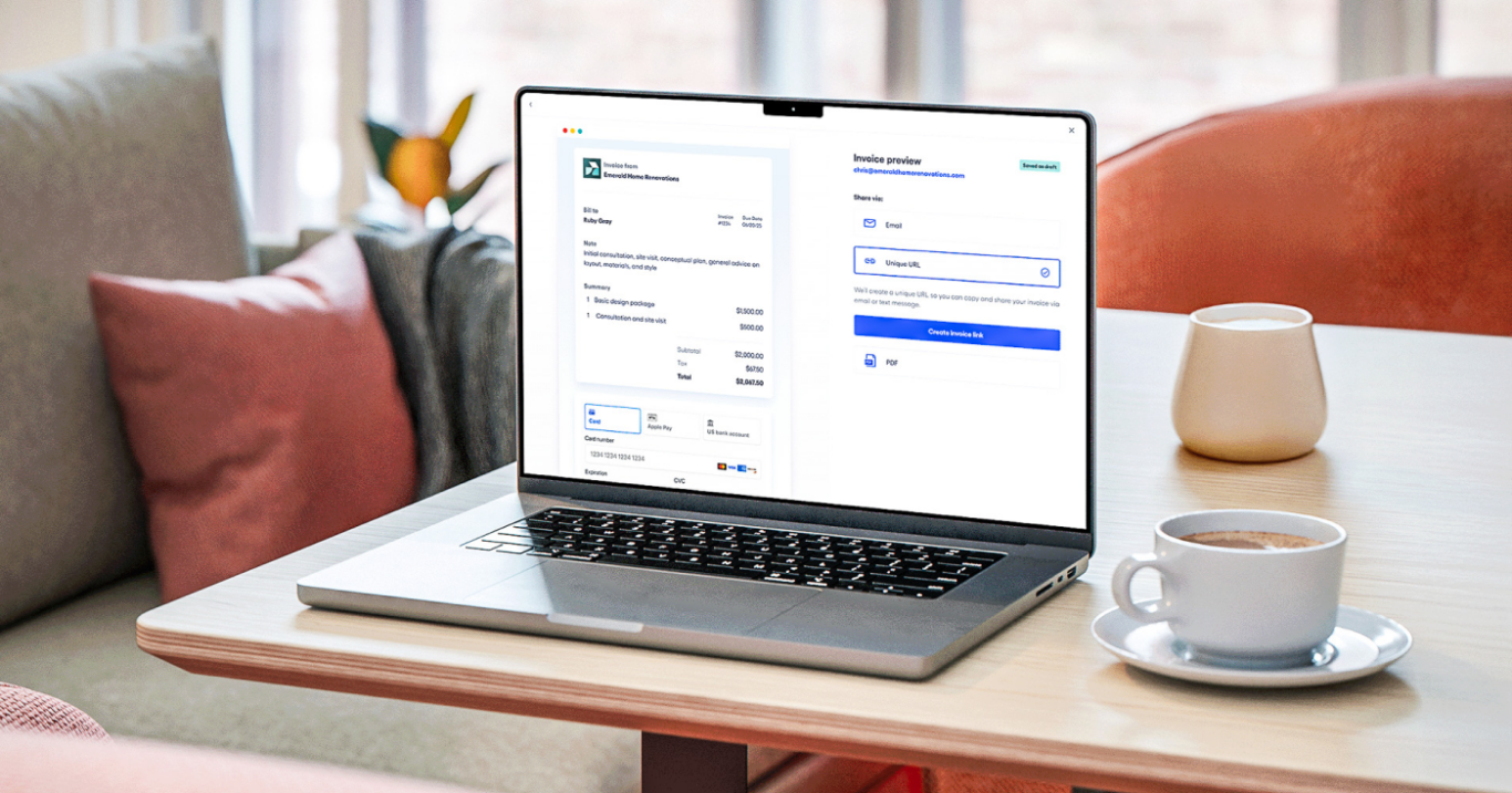 Photo of small business owner's laptop, showing Bluevine's invoicing and payment links product UI.